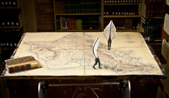 Contact Dermatitis 2011 Kiln cast glass, bronze, map 42" x 30" x 48" photo: Dustin Miyakawa 